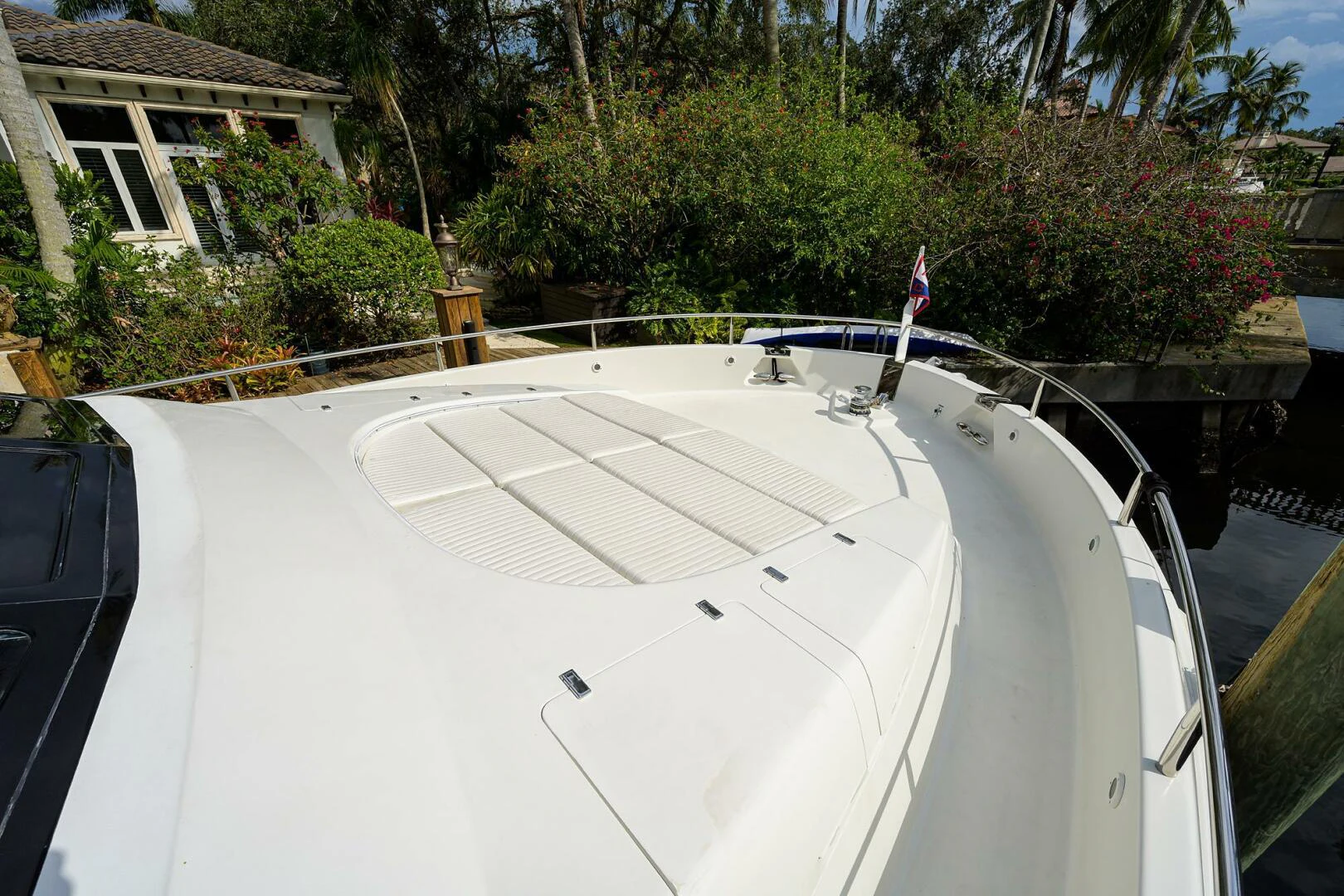 a white car with a flag on the roof aboard LOST TEXAN Yacht for Sale