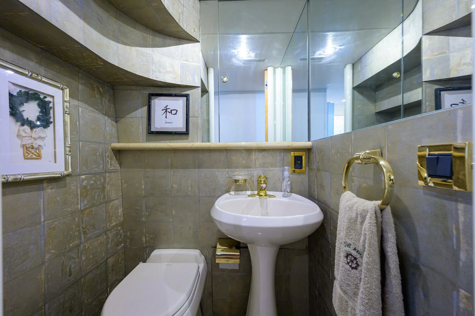 a bathroom with a sink and toilet aboard LOST TEXAN Yacht for Sale