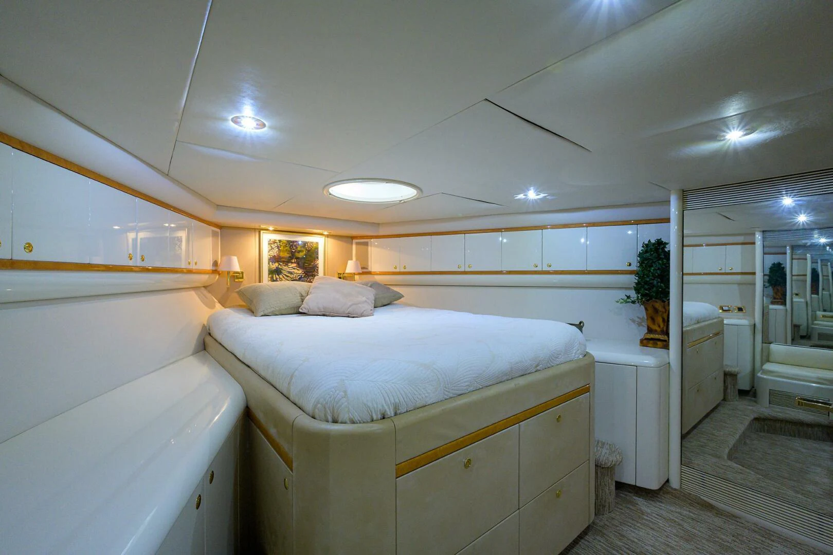 a bedroom with a bed and a closet aboard LOST TEXAN Yacht for Sale