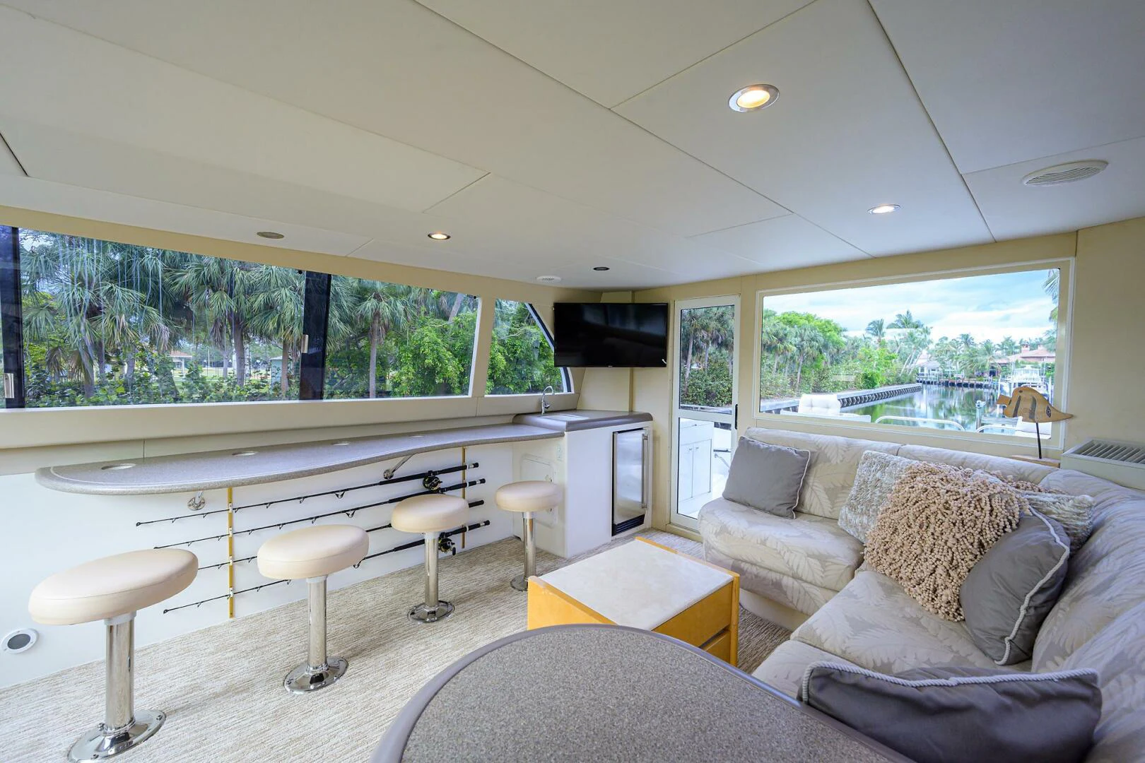 a living room with a large window aboard LOST TEXAN Yacht for Sale