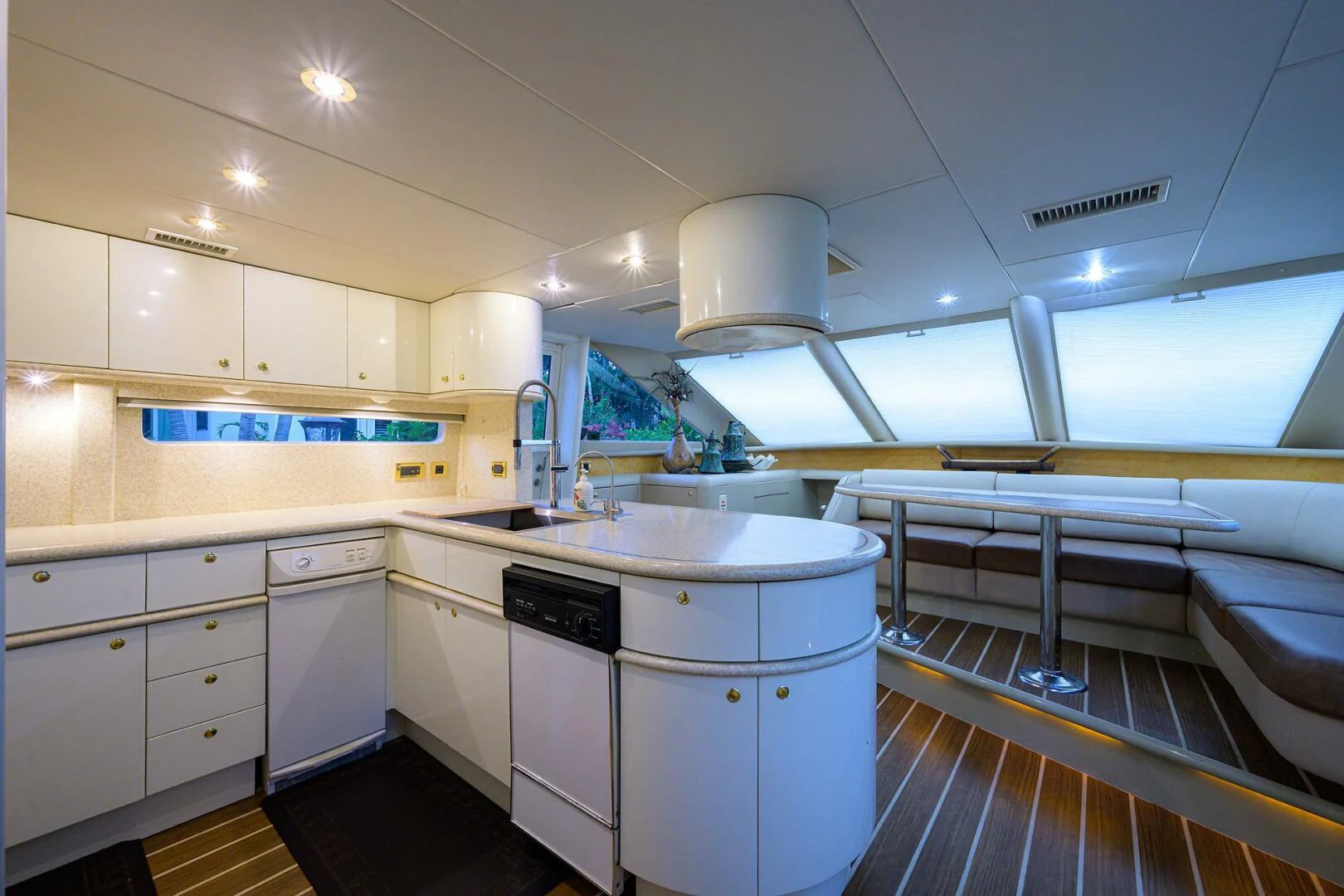 a kitchen with a large window aboard LOST TEXAN Yacht for Sale