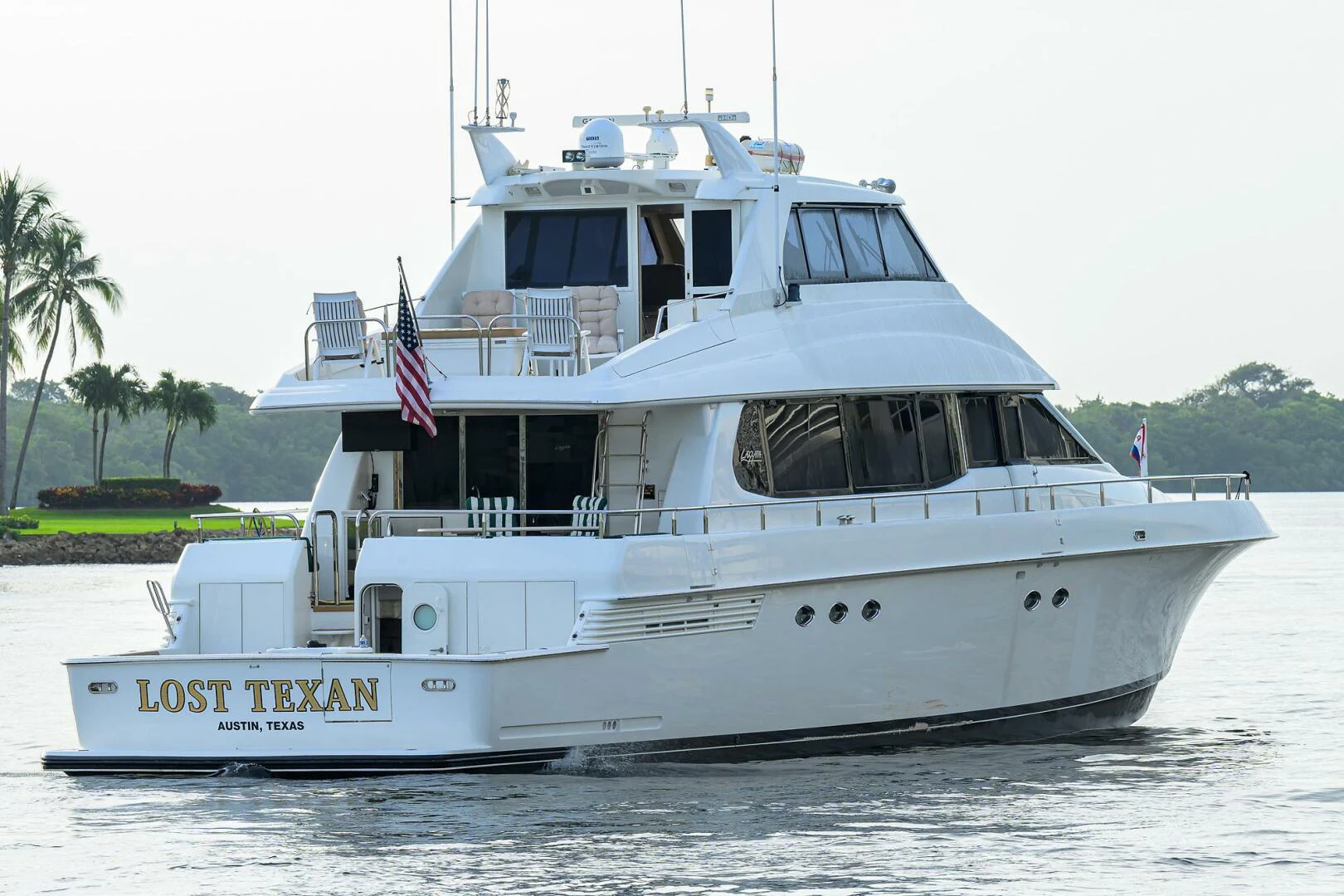a white boat on the water aboard LOST TEXAN Yacht for Sale