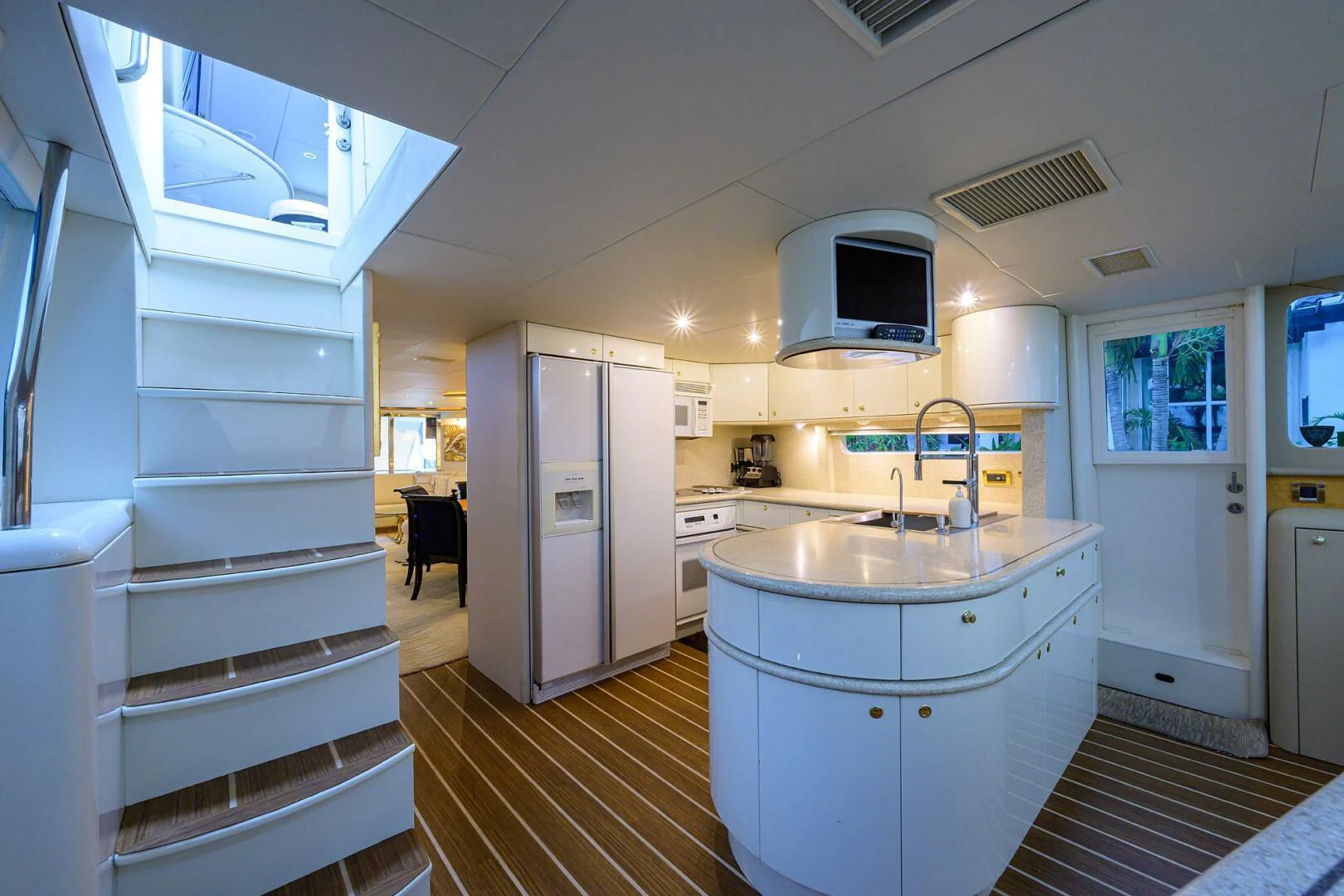 a kitchen with a microwave oven and refrigerator aboard LOST TEXAN Yacht for Sale