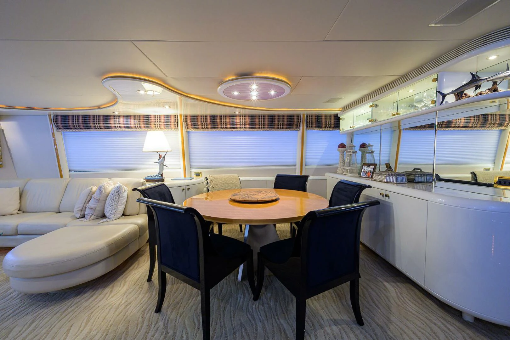 a room with a table and chairs aboard LOST TEXAN Yacht for Sale