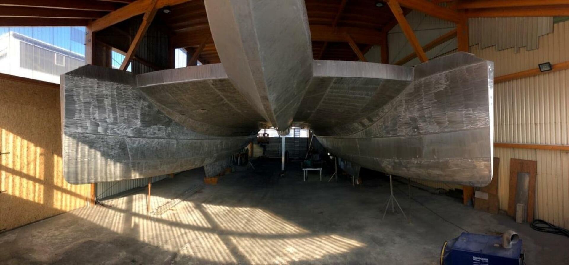 a large metal object in a building aboard CUSTOM 107 CATAMARAN Yacht for Sale