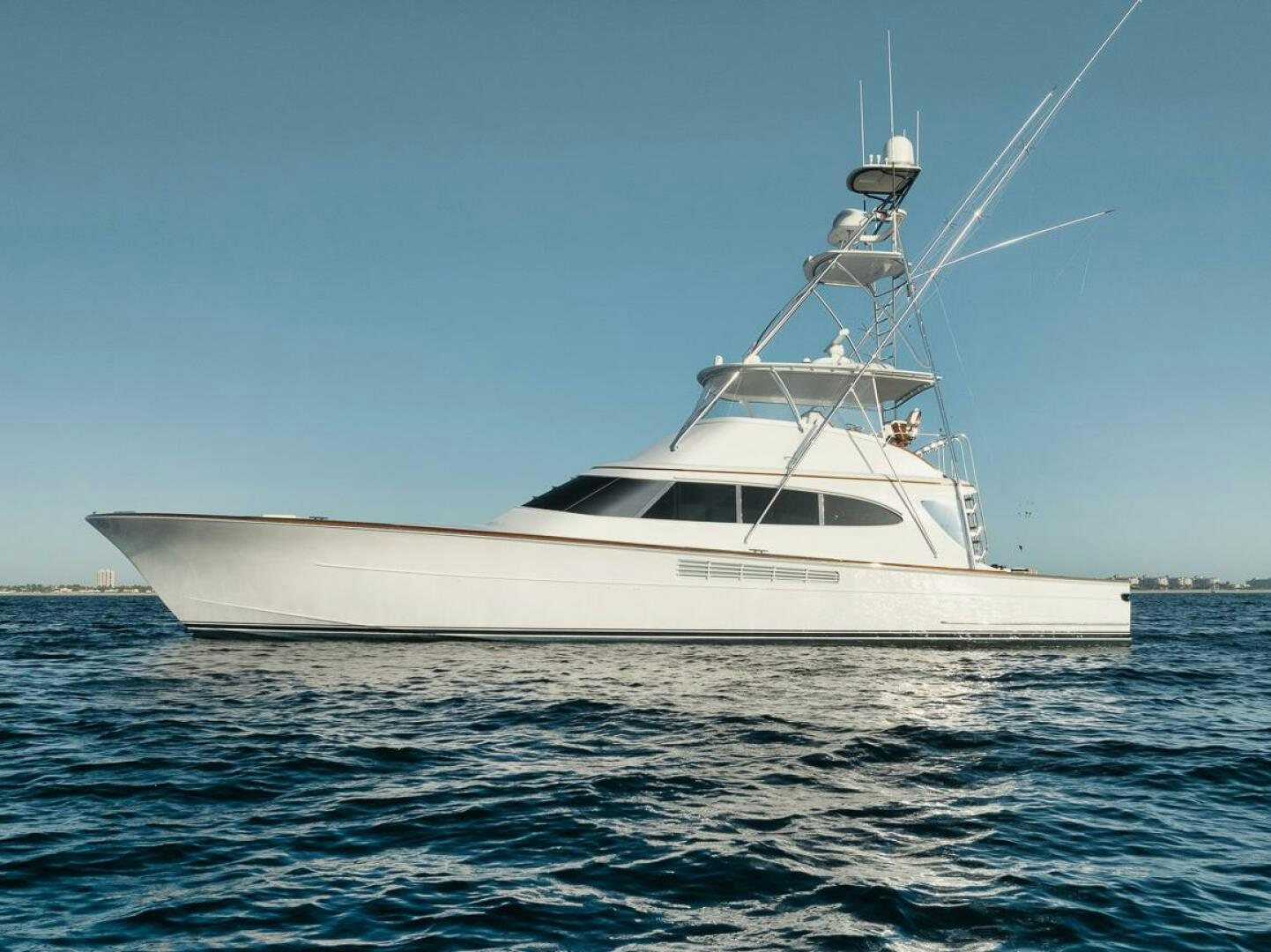 a white yacht in the water aboard HULLBILLY Yacht for Sale