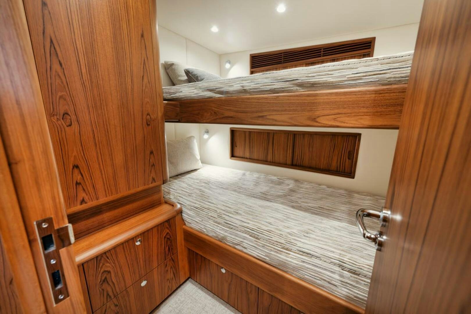 a room with wooden cabinets aboard HULLBILLY Yacht for Sale