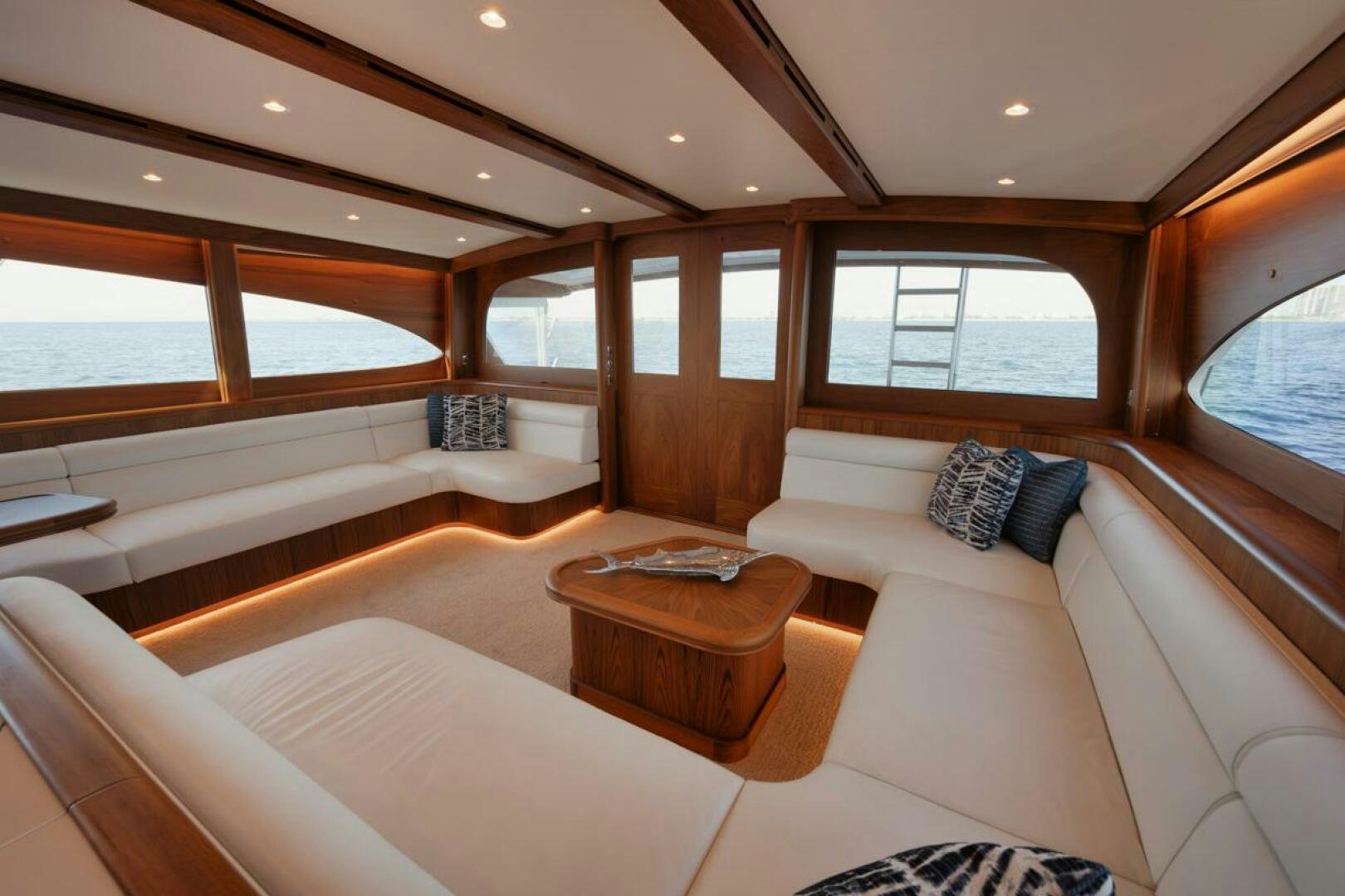 a room with a couch and a table aboard HULLBILLY Yacht for Sale