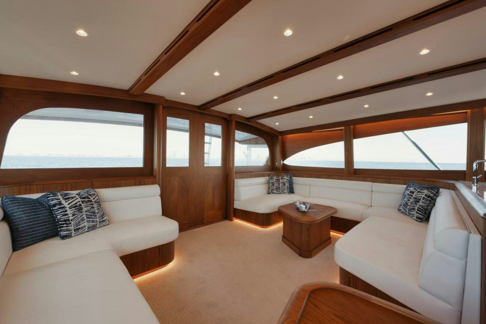 a living room with a couch and a table aboard HULLBILLY Yacht for Sale