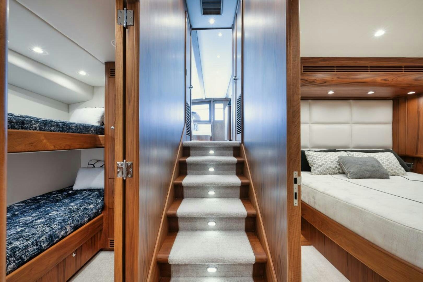 a room with a bed and a wood door aboard HULLBILLY Yacht for Sale