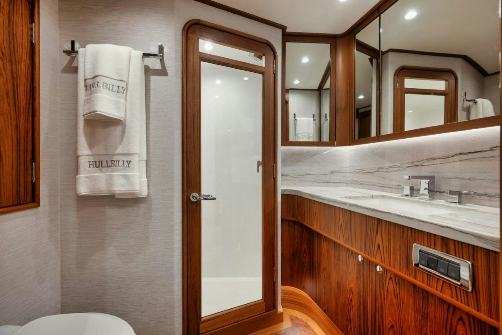 a bathroom with a sink and a mirror aboard HULLBILLY Yacht for Sale