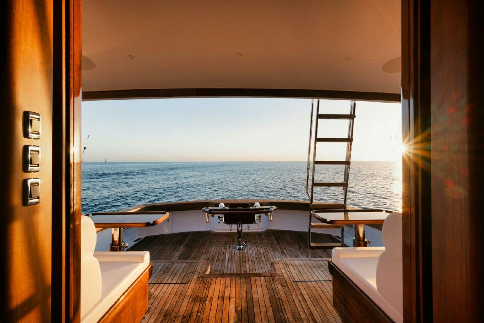 a room with a view of the ocean and a deck aboard HULLBILLY Yacht for Sale