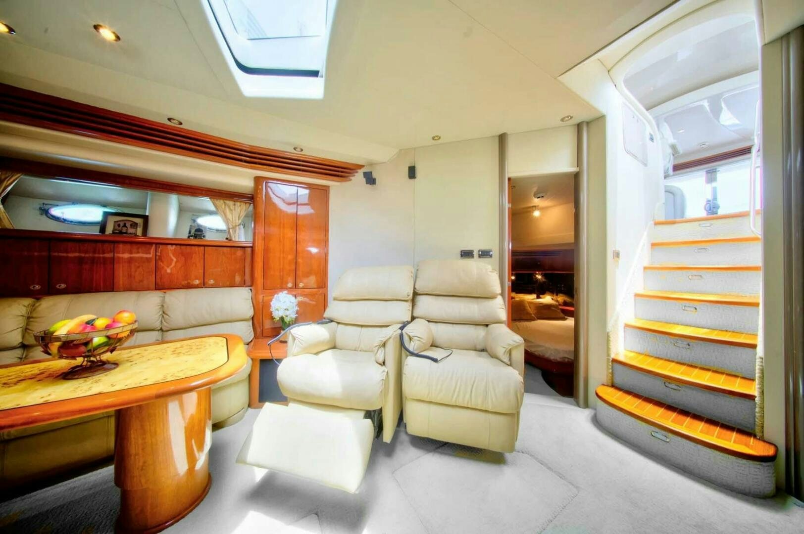 a room with a bed and a table aboard FAIRYTALE Yacht for Sale