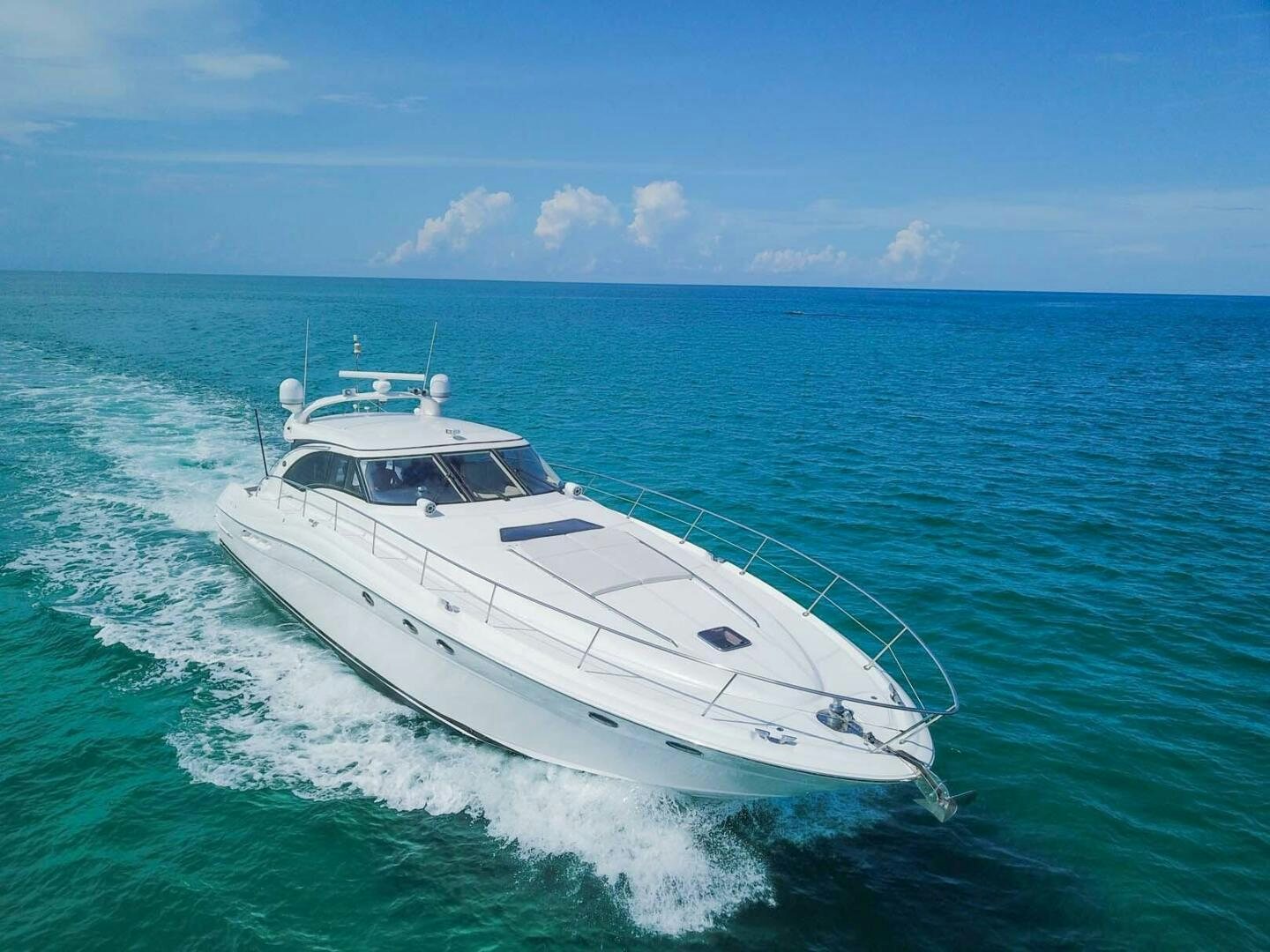a white yacht in the ocean aboard FAIRYTALE Yacht for Sale
