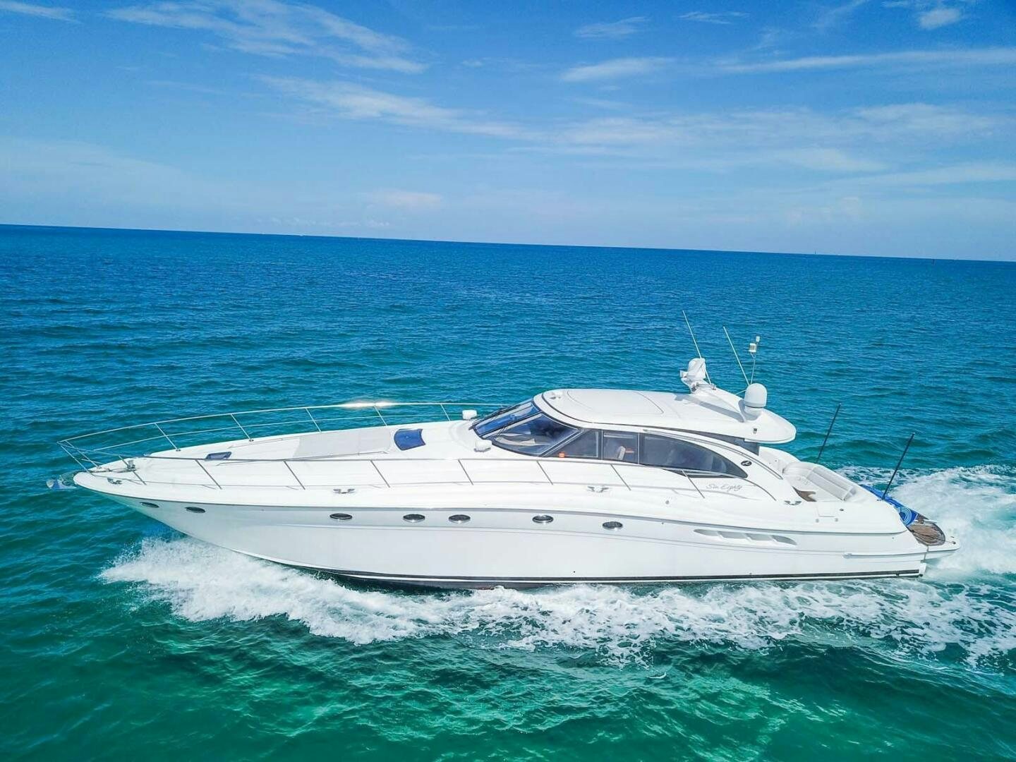 a white boat in the water aboard FAIRYTALE Yacht for Sale