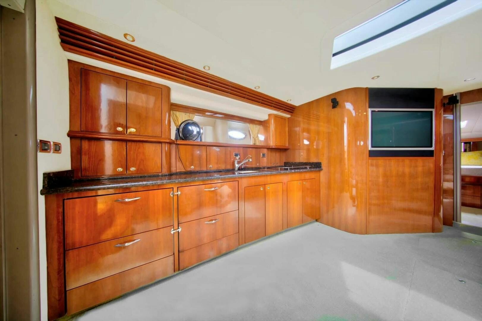 a room with wooden cabinets aboard FAIRYTALE Yacht for Sale