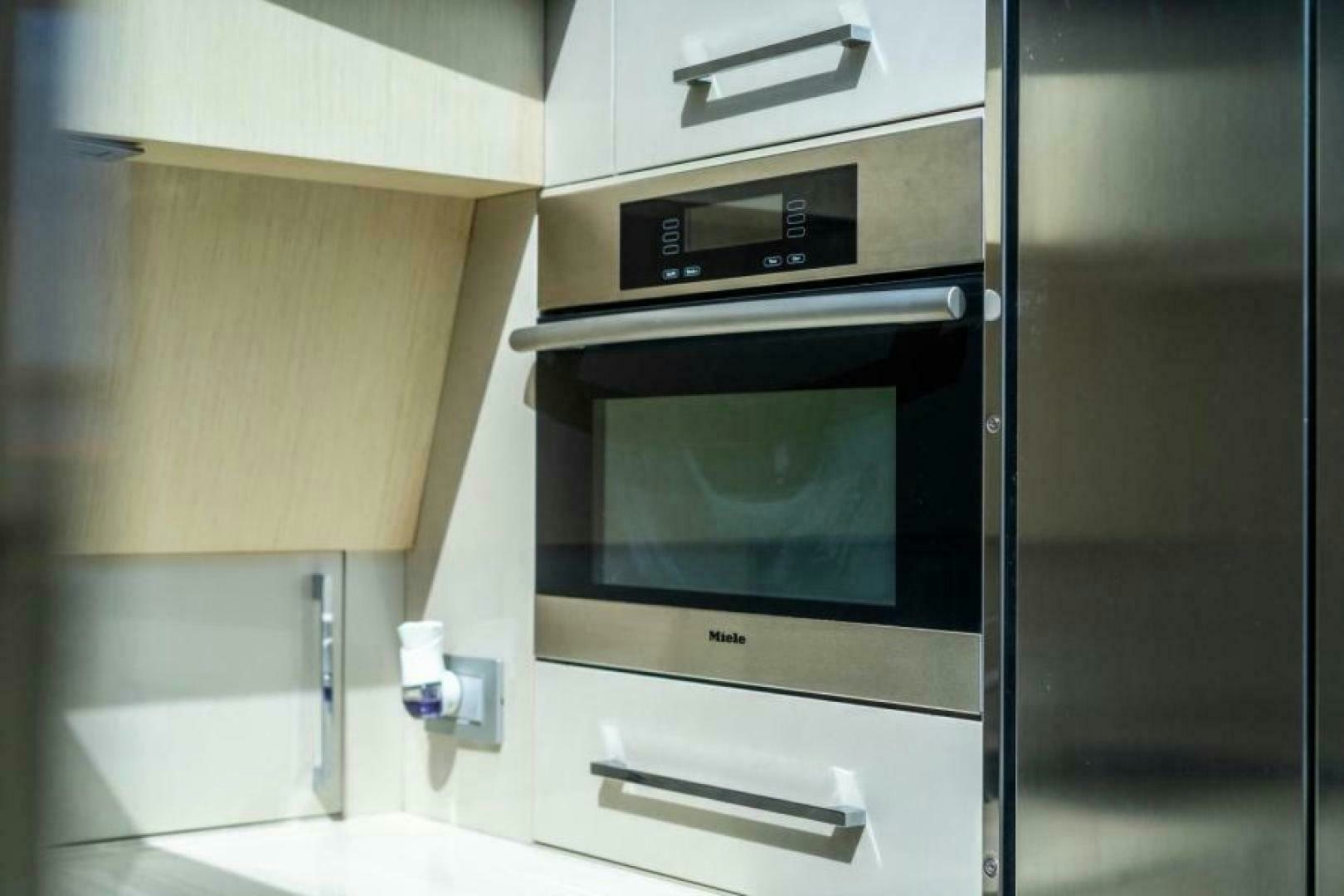 a microwave oven in a kitchen aboard EQUINOX Yacht for Sale