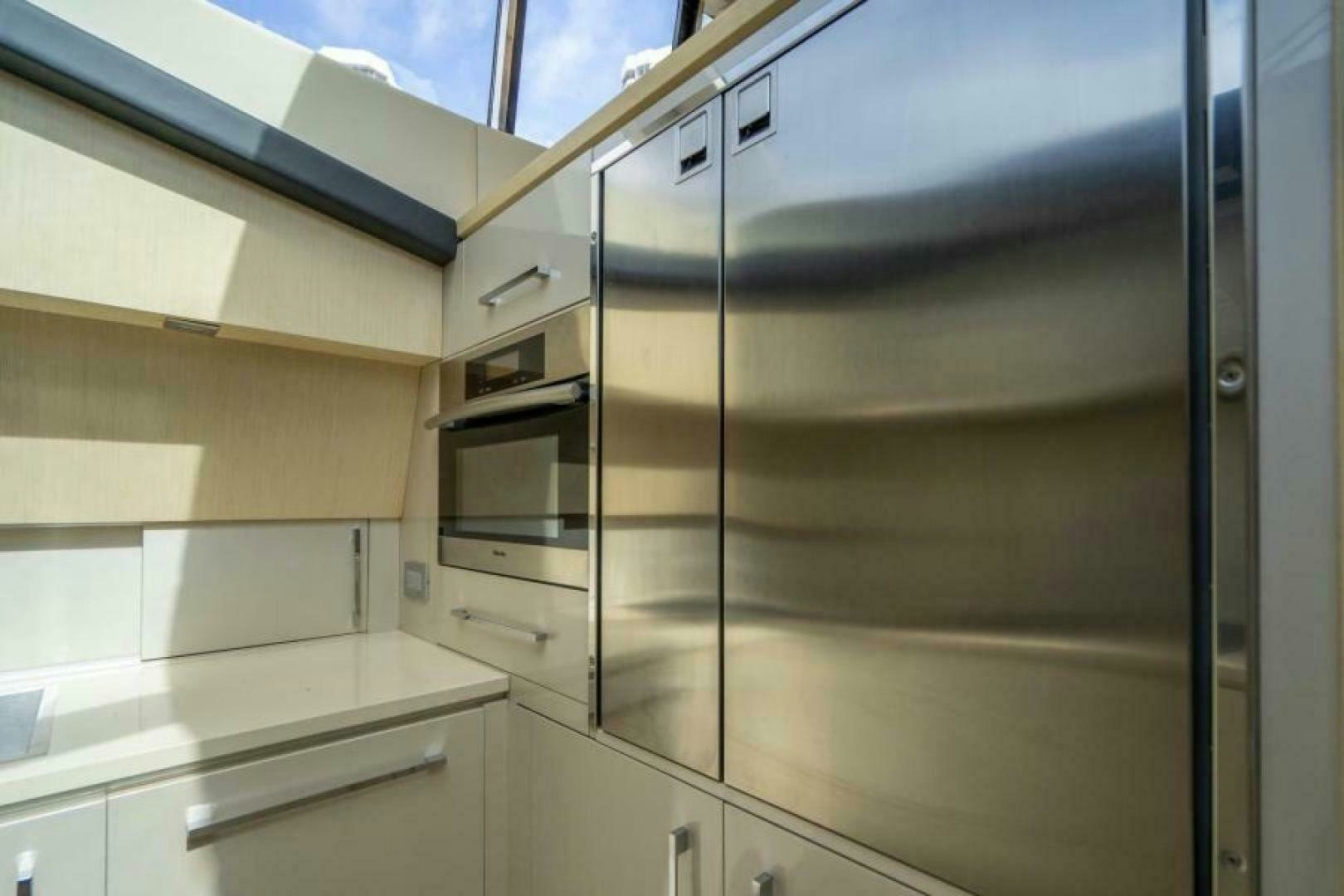 a room with cabinets and drawers aboard EQUINOX Yacht for Sale