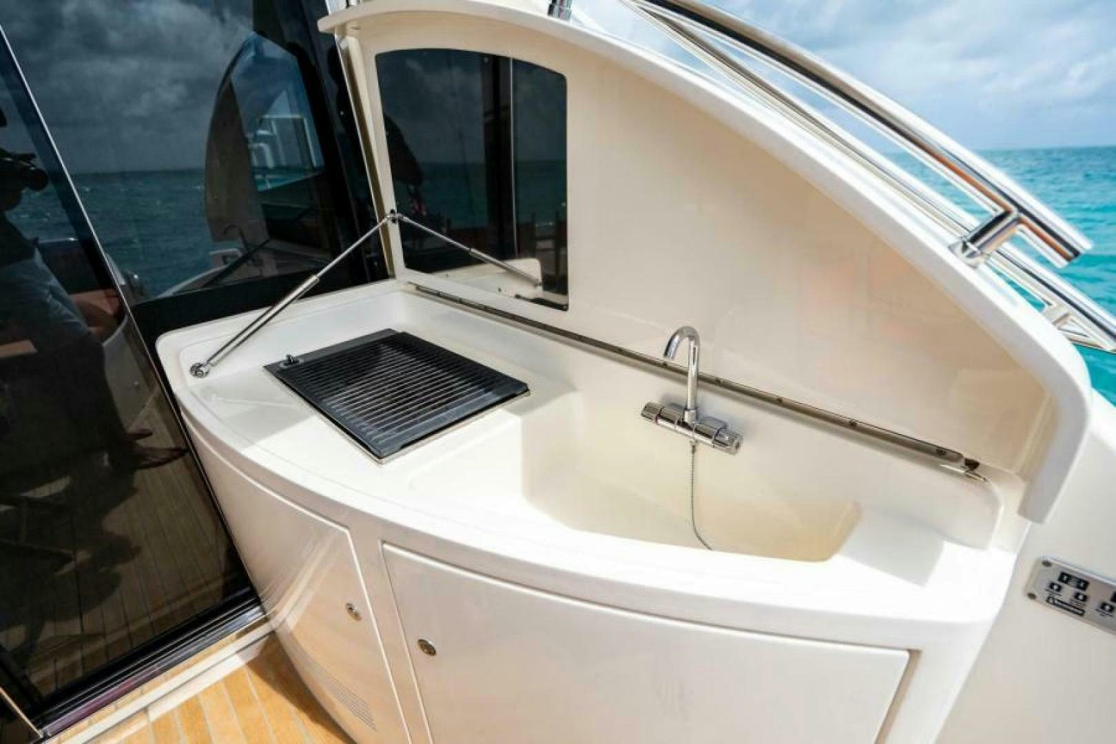 a white boat with a sink aboard EQUINOX Yacht for Sale