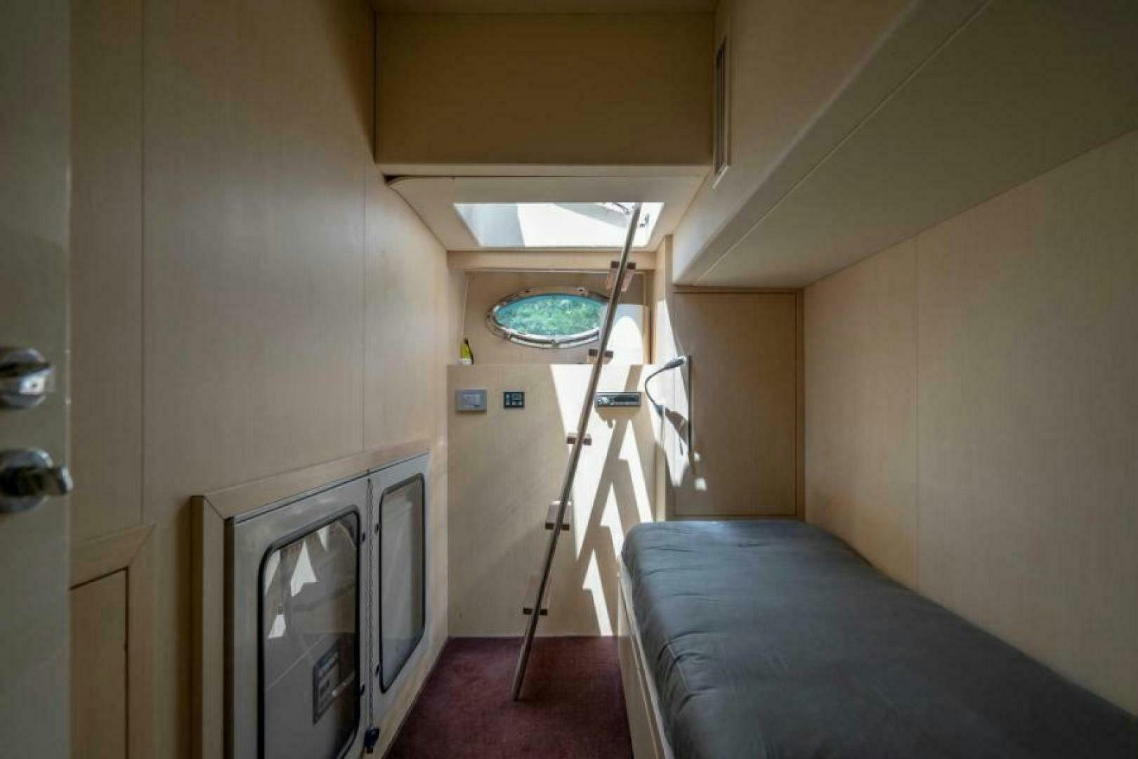 a bed in a room aboard EQUINOX Yacht for Sale