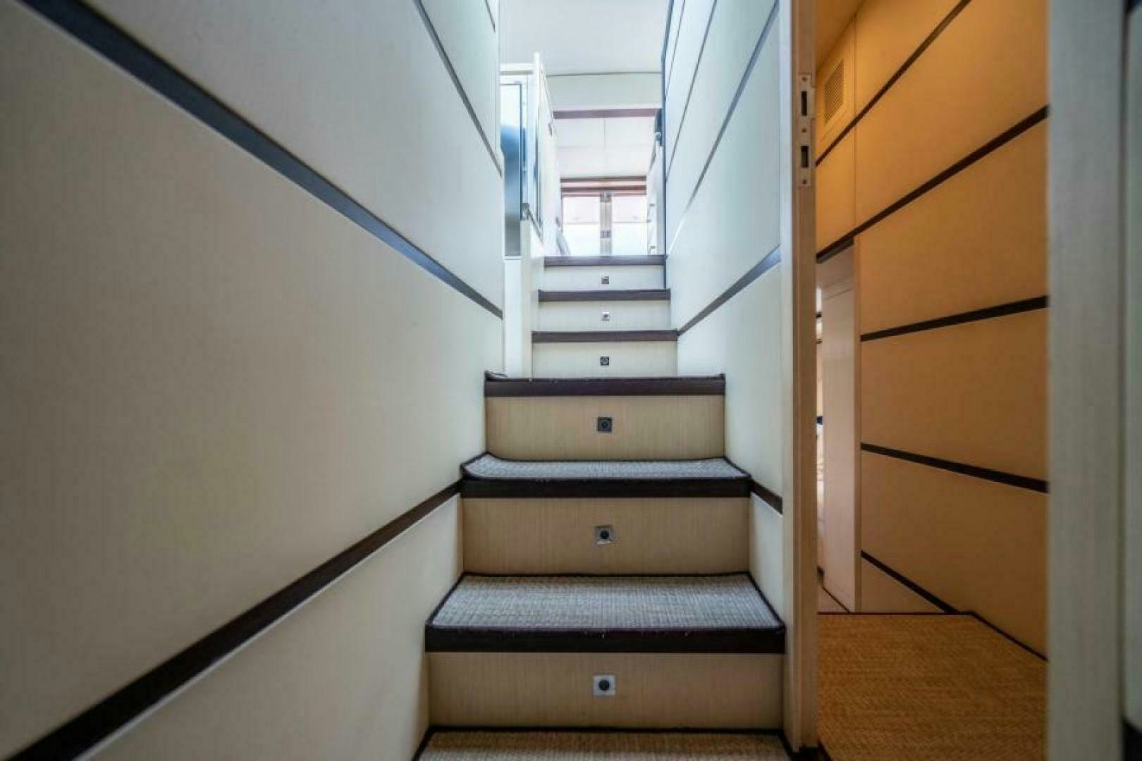a set of stairs in a room aboard EQUINOX Yacht for Sale