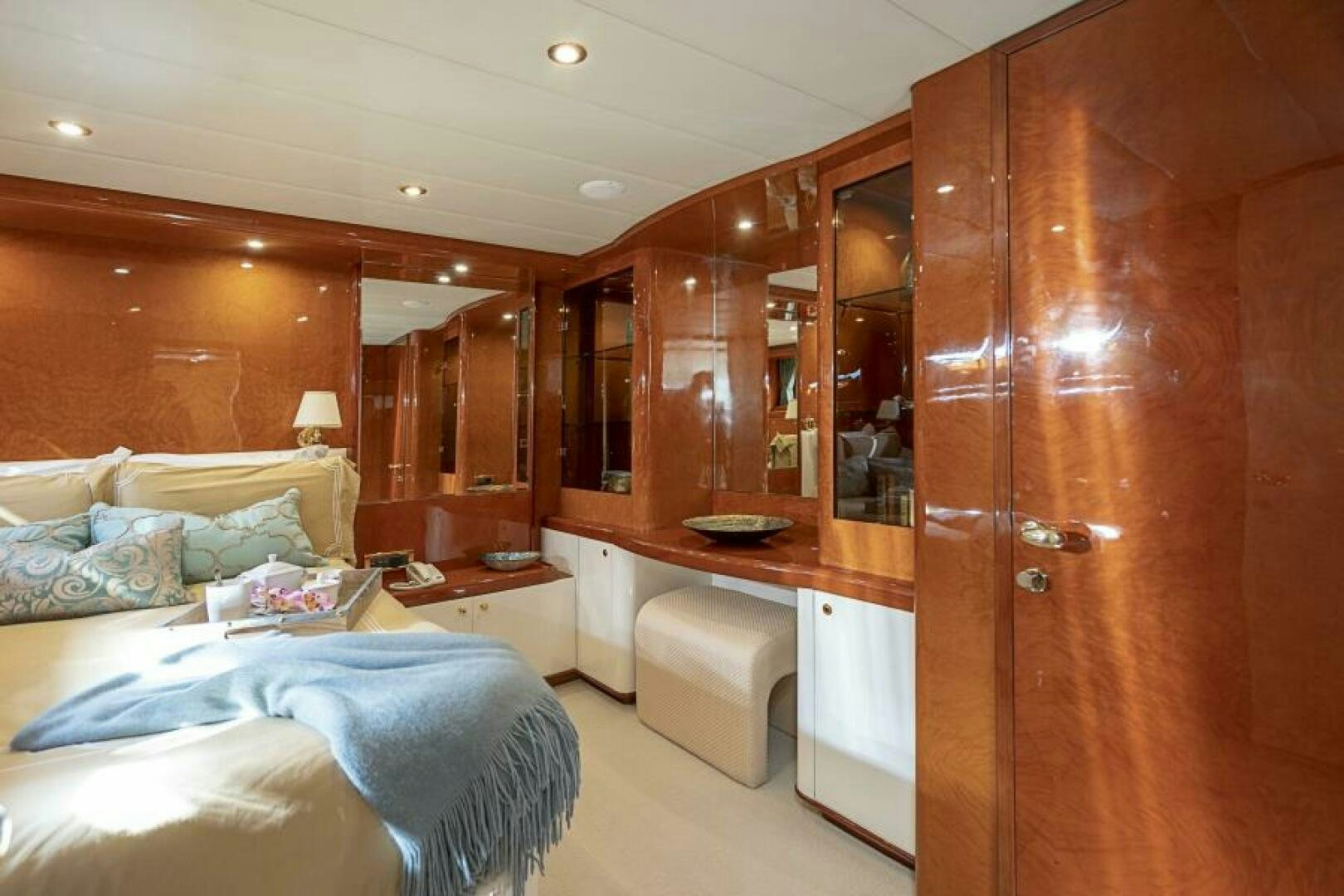 a room with a bed and a desk aboard SIXTY SIX Yacht for Sale