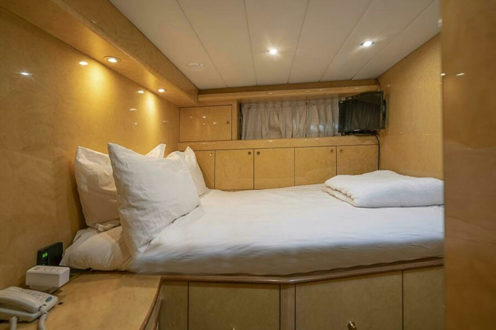 a bed with white sheets aboard SIXTY SIX Yacht for Sale