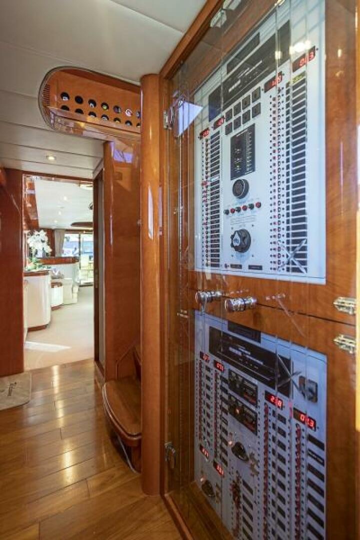 a room with a wood door and a large mirror aboard SIXTY SIX Yacht for Sale