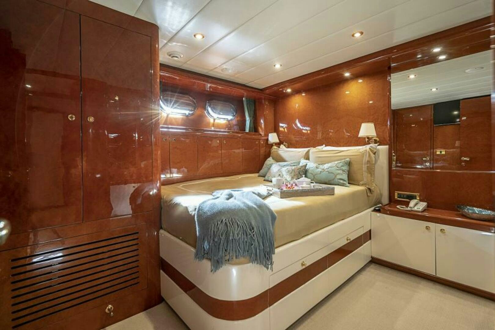a room with a bed and a desk aboard SIXTY SIX Yacht for Sale