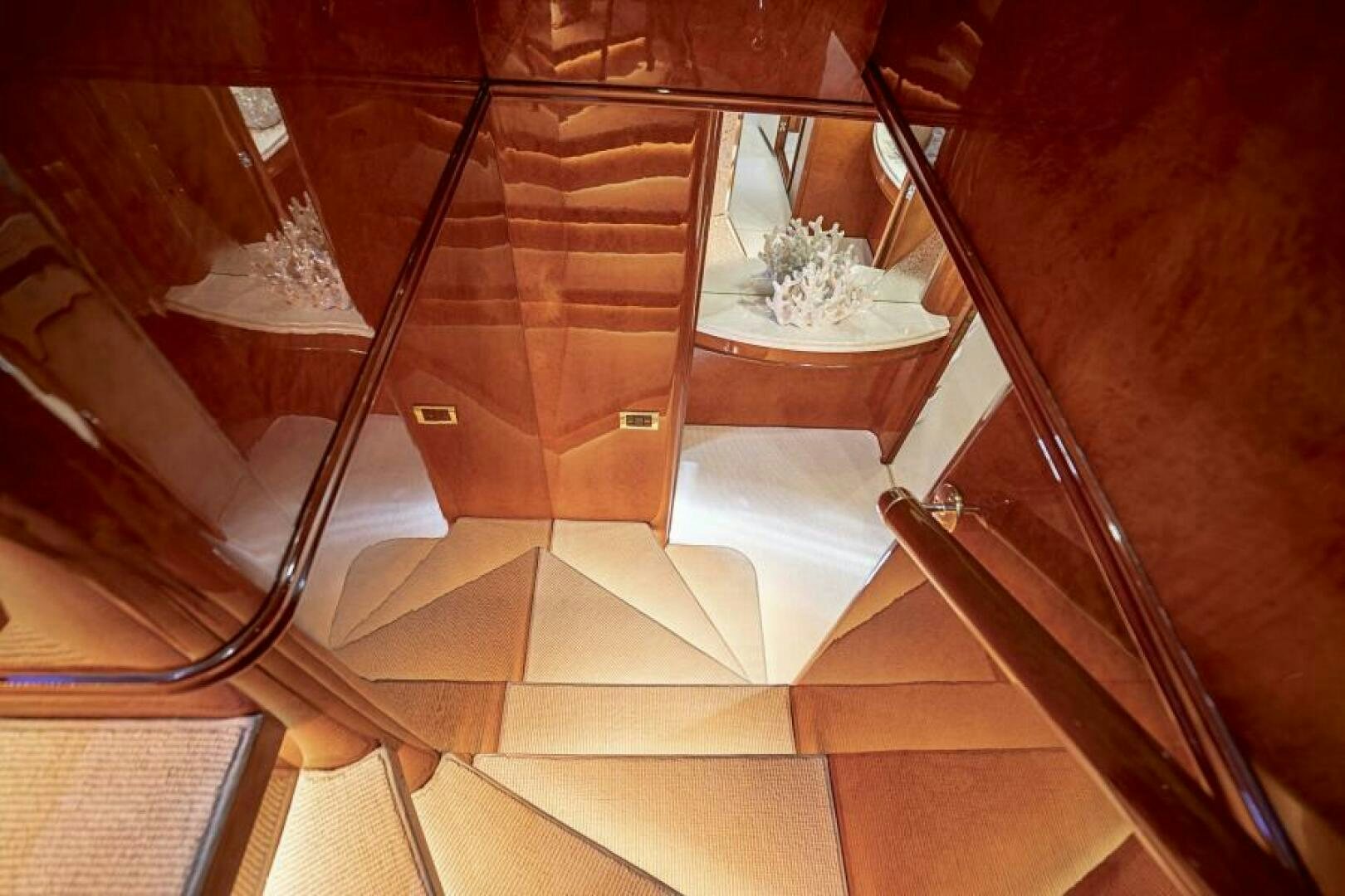 a staircase with a glass window aboard SIXTY SIX Yacht for Sale