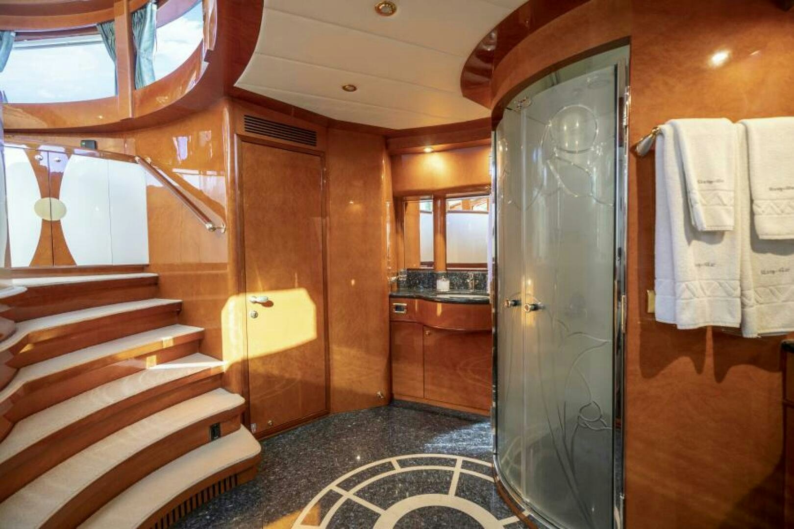 a bathroom with a glass shower aboard SIXTY SIX Yacht for Sale