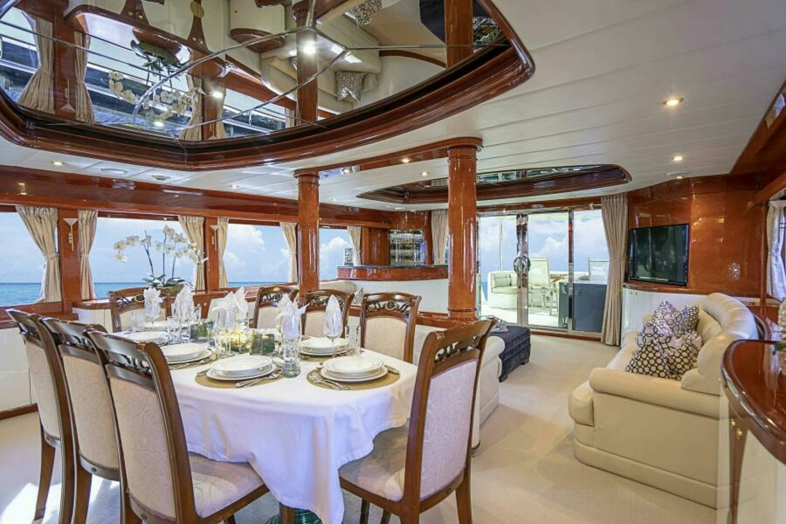 a dining room with a table and chairs aboard SIXTY SIX Yacht for Sale