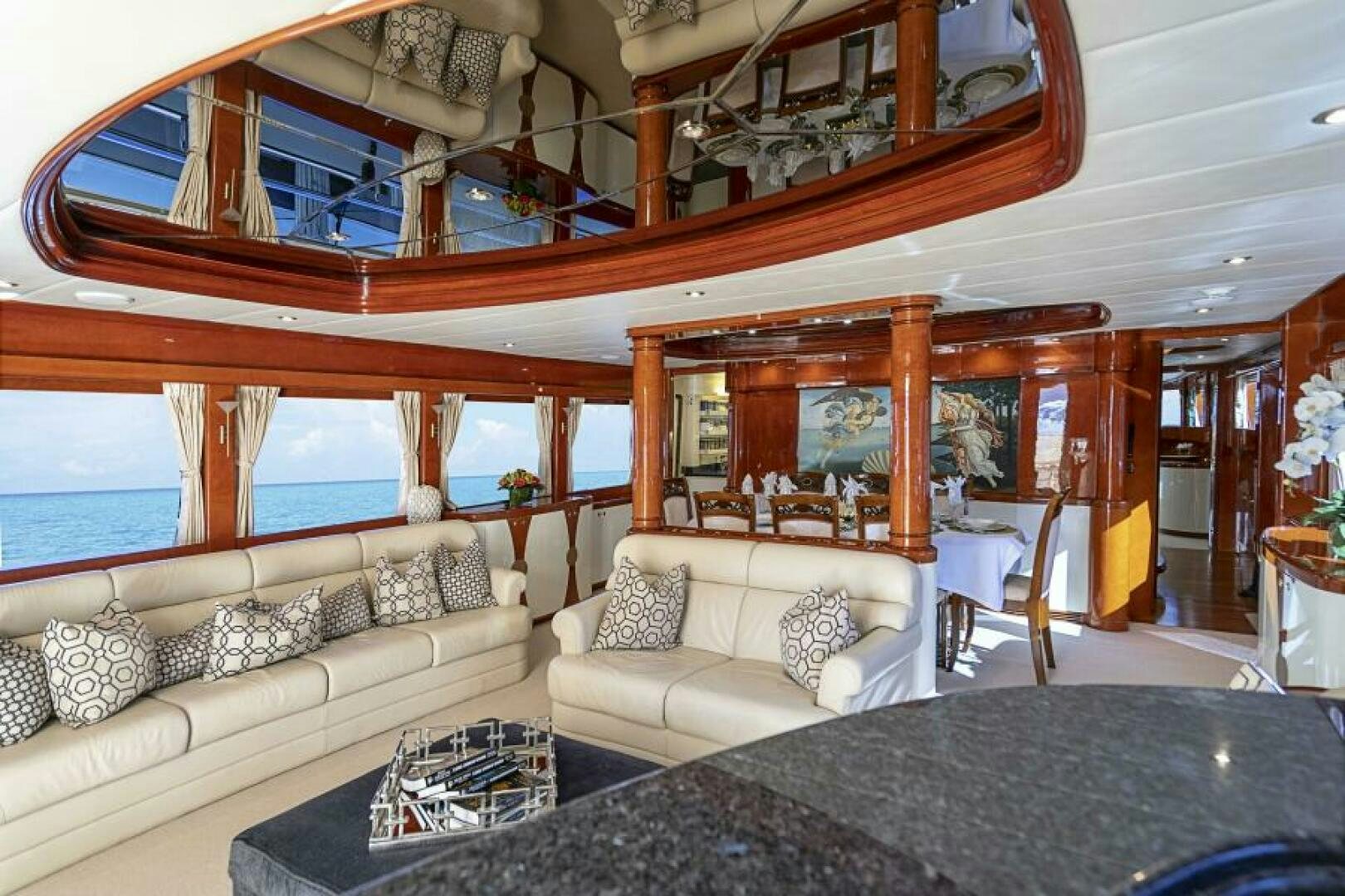 a living room with a large bed aboard SIXTY SIX Yacht for Sale