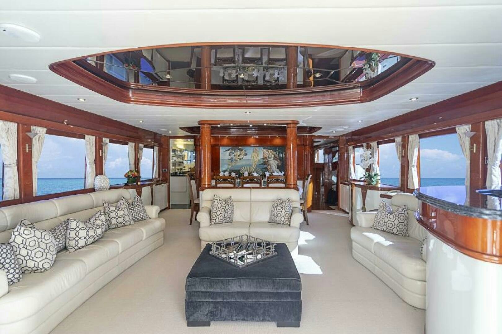 a living room with a large fireplace aboard SIXTY SIX Yacht for Sale