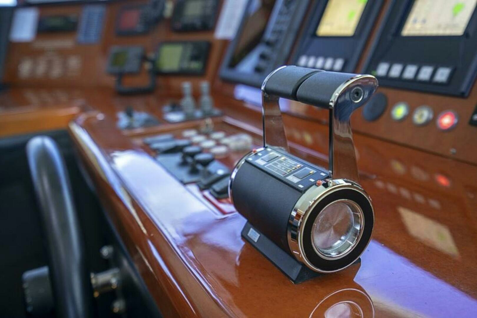 a camera on a table aboard SIXTY SIX Yacht for Sale