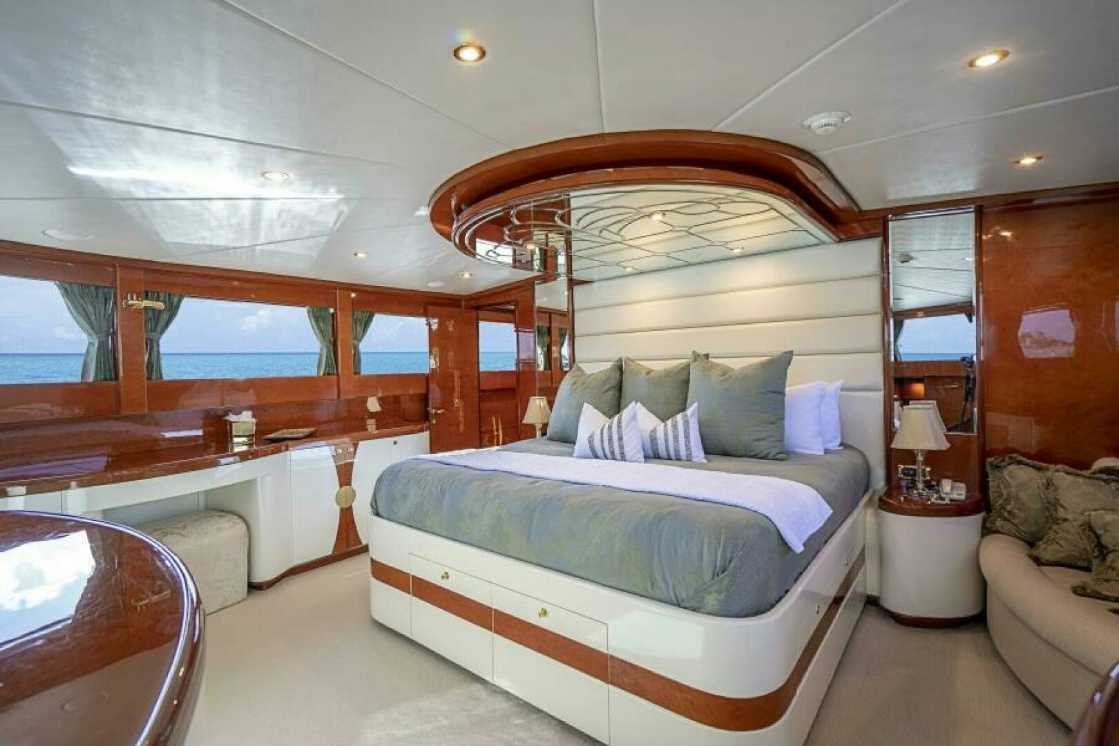 a room with a bed and a couch aboard SIXTY SIX Yacht for Sale