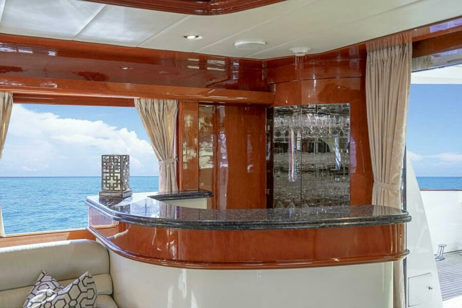a room with a view of the ocean and a large window aboard SIXTY SIX Yacht for Sale