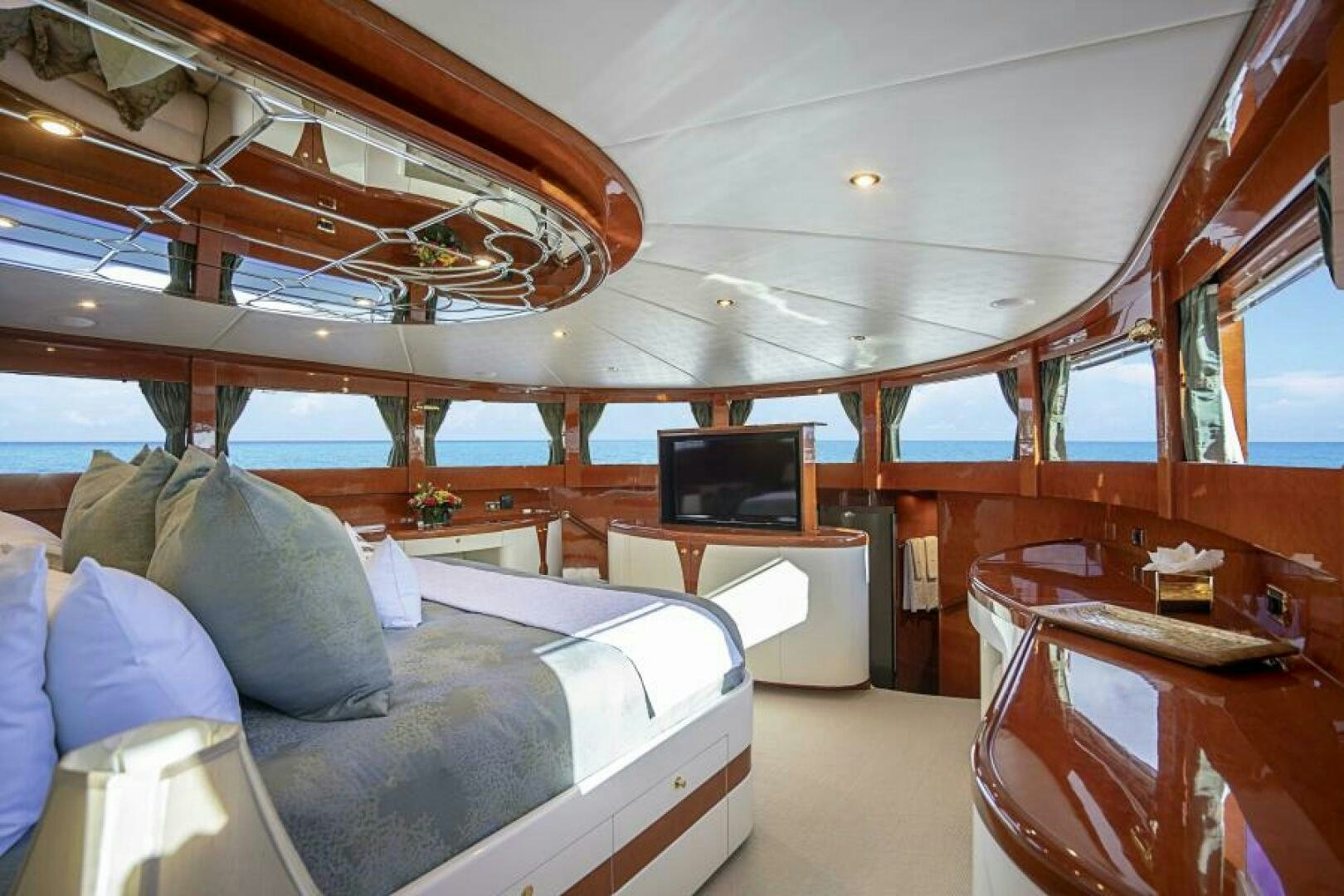 a room with a bed and a desk aboard SIXTY SIX Yacht for Sale
