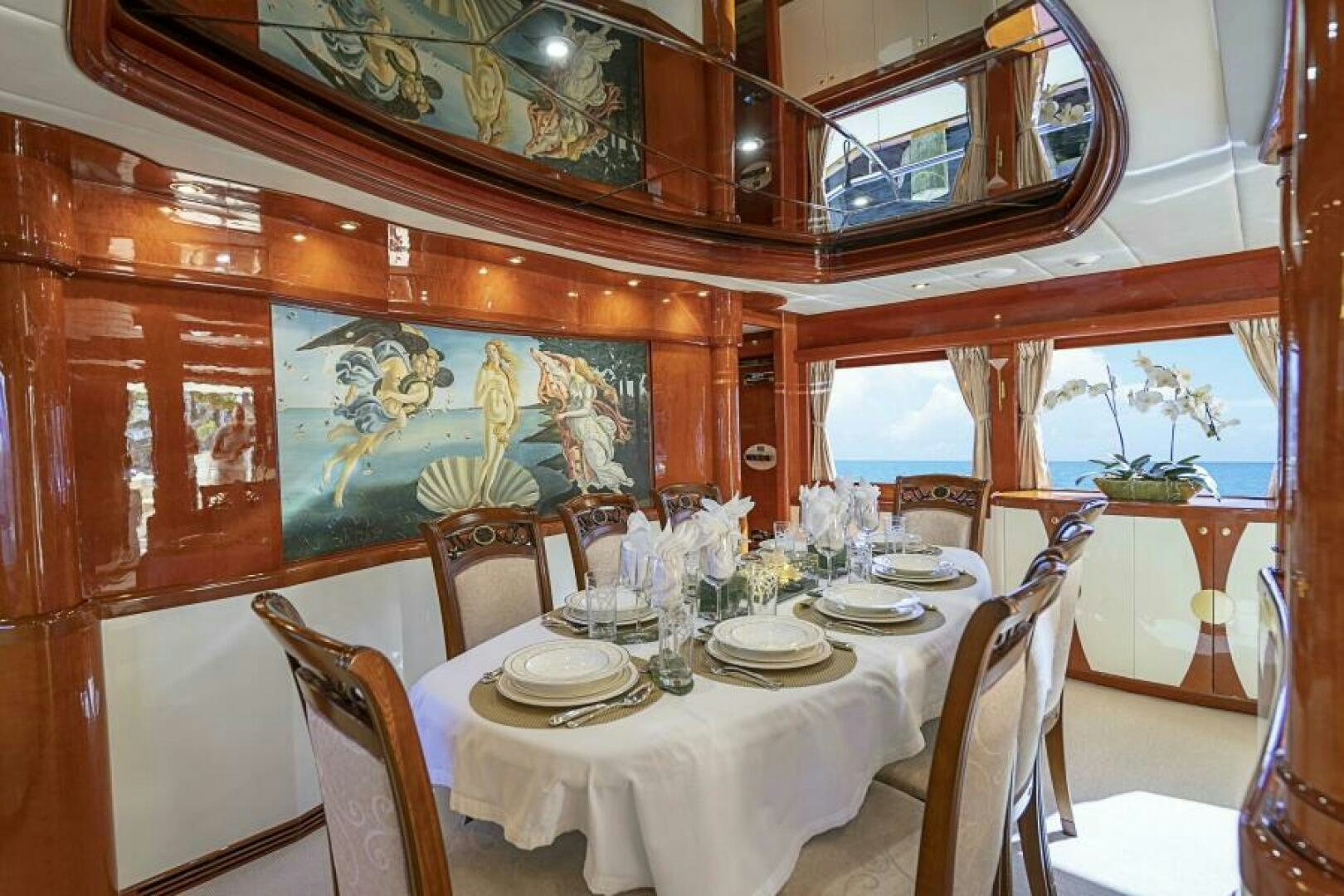 a dining table set for a dinner aboard SIXTY SIX Yacht for Sale