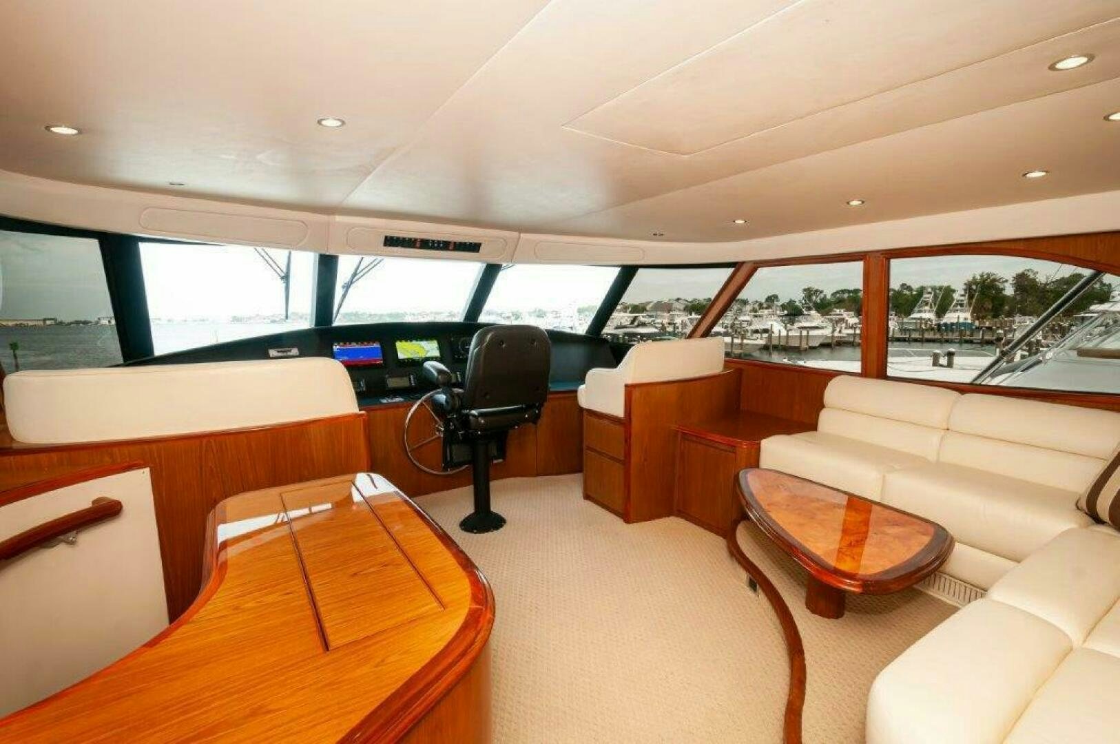 inside of a vehicle with a chair and a table and chairs aboard BAREFOOT DRIVE Yacht for Sale