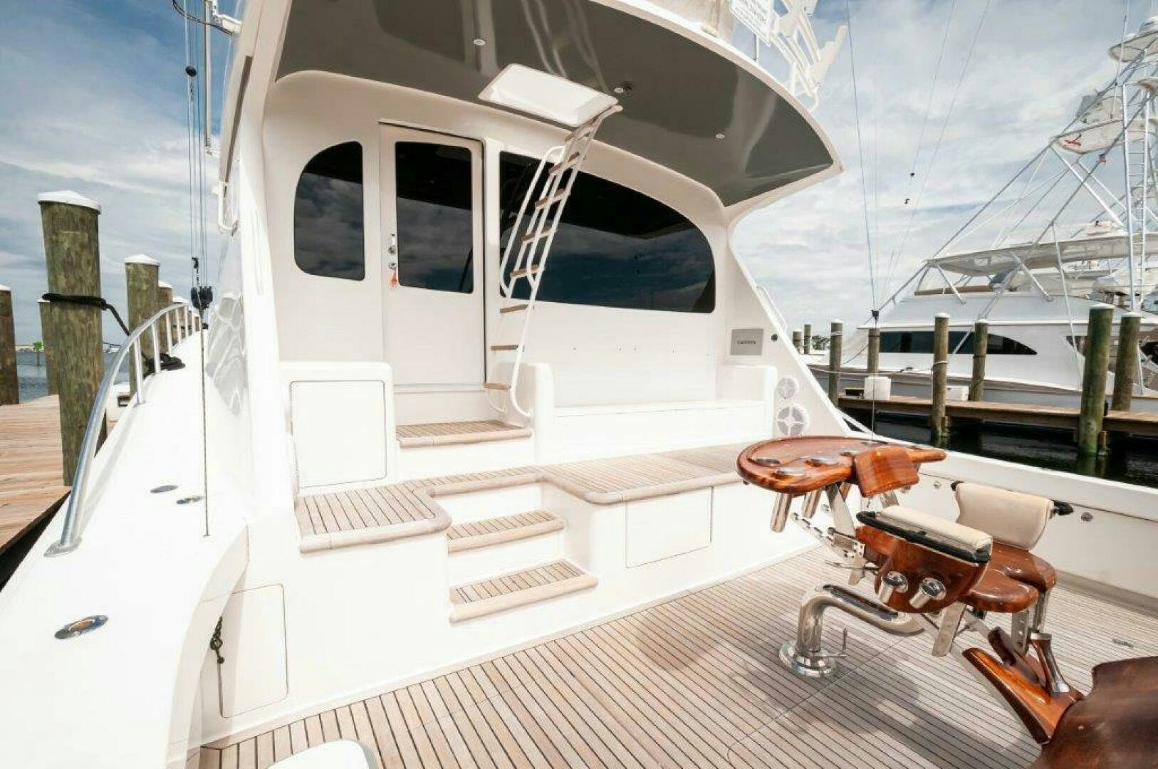 a white boat on a deck aboard BAREFOOT DRIVE Yacht for Sale