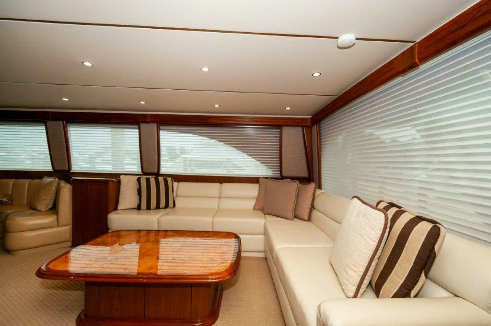 a living room with a couch and a table aboard BAREFOOT DRIVE Yacht for Sale