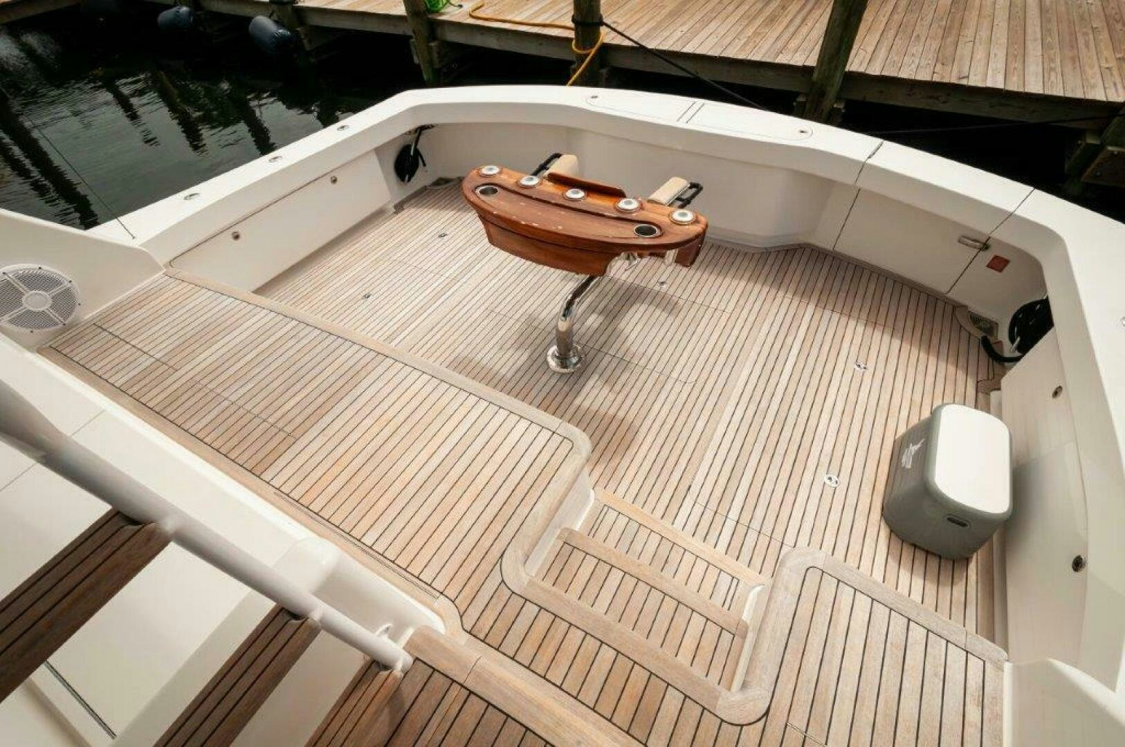a wooden boat on a deck aboard BAREFOOT DRIVE Yacht for Sale