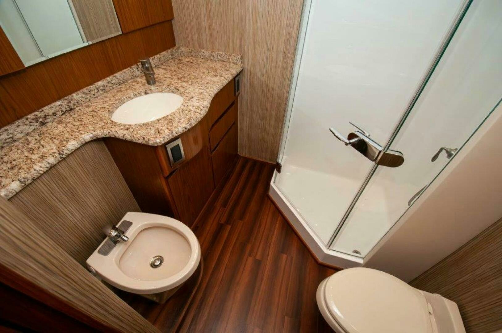 a bathroom with a sink and a bathtub aboard BAREFOOT DRIVE Yacht for Sale