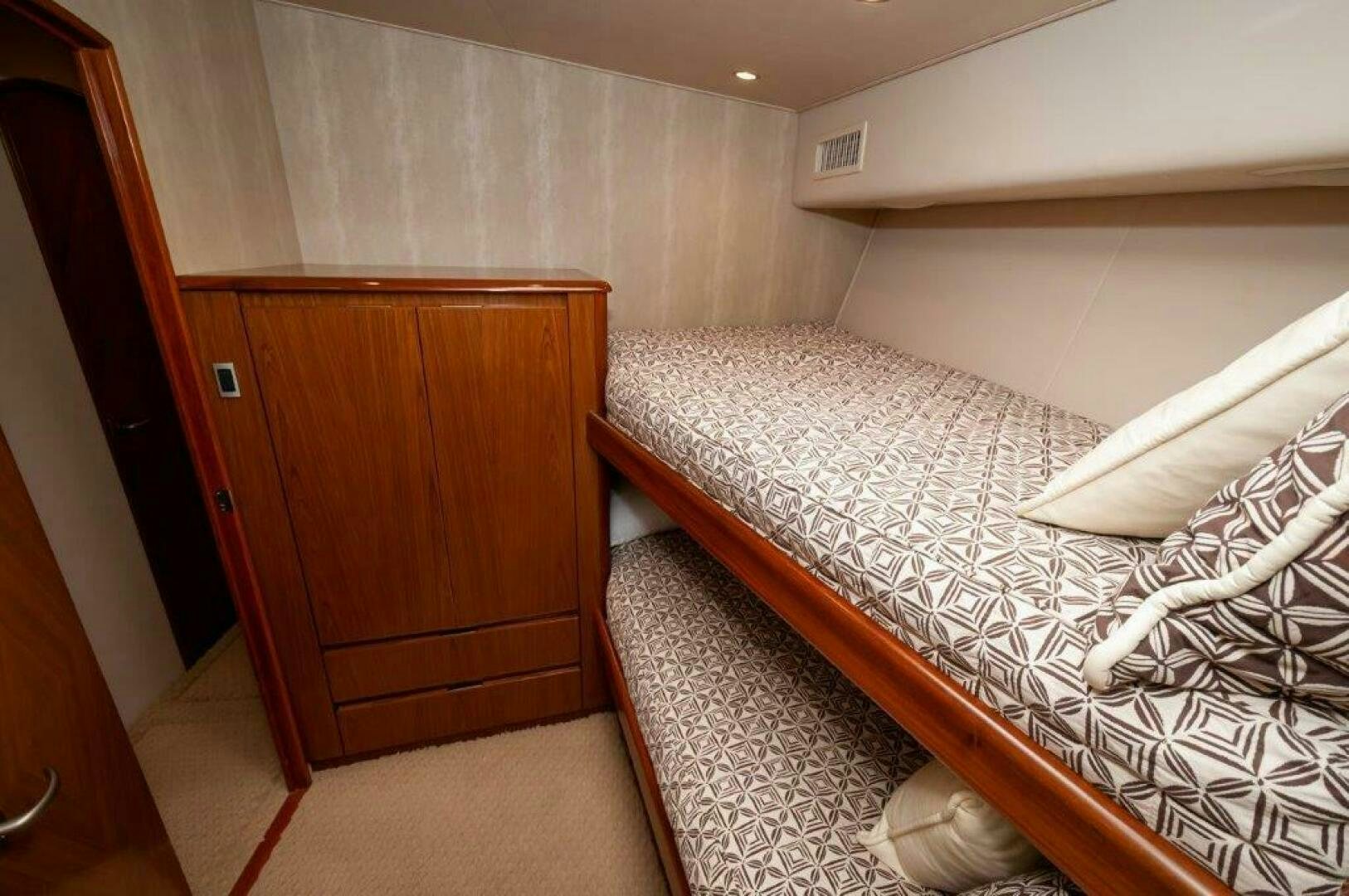 a bed with a white sheet aboard BAREFOOT DRIVE Yacht for Sale