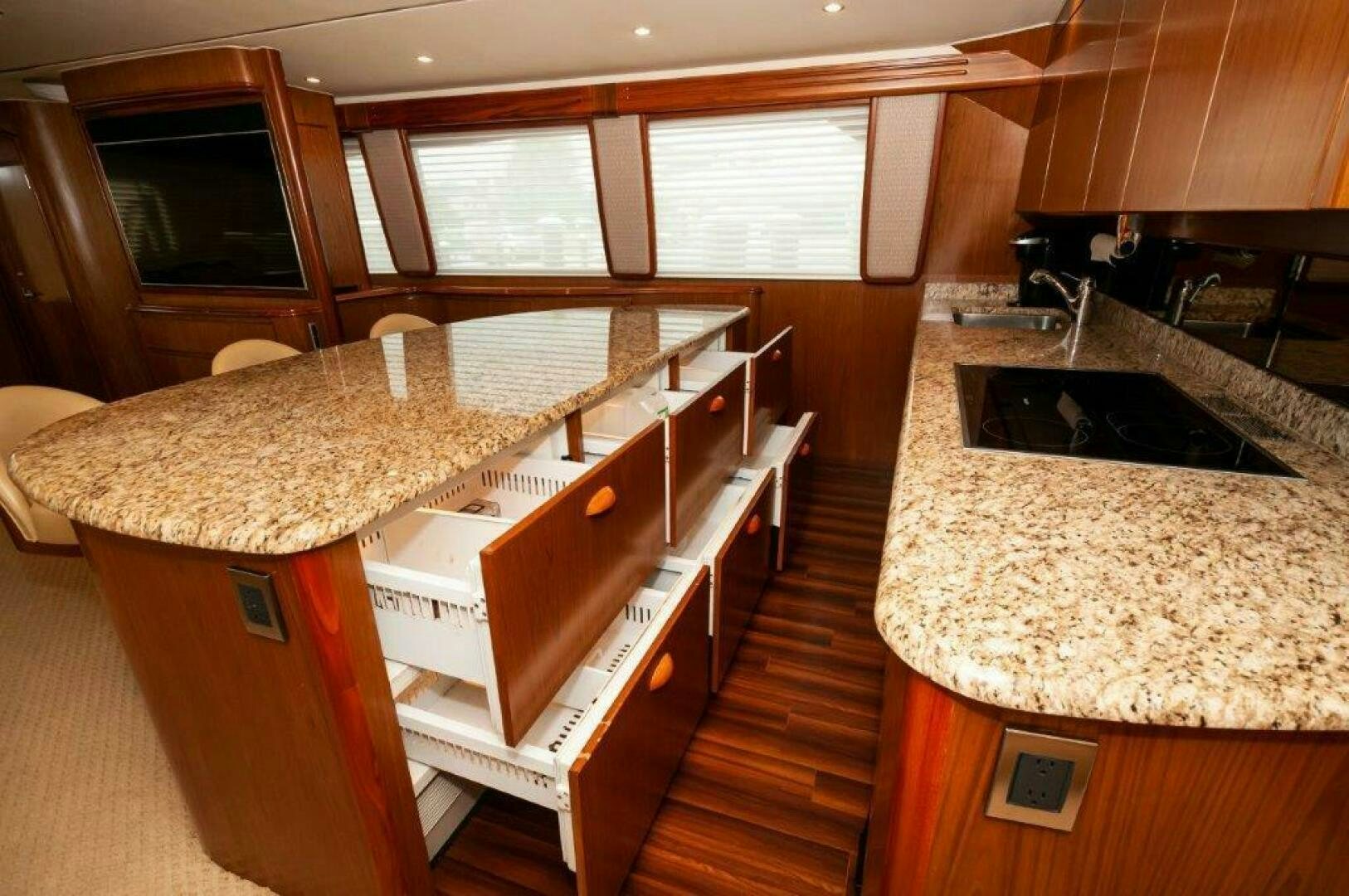 a kitchen with a countertop sink and cabinets aboard BAREFOOT DRIVE Yacht for Sale