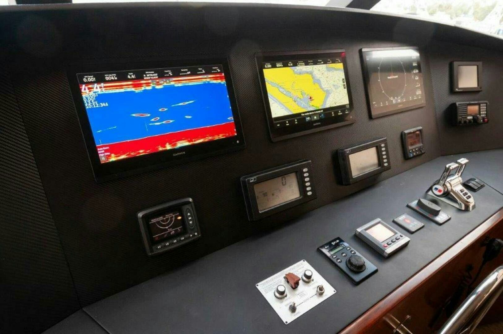 a computer with a screen and buttons aboard BAREFOOT DRIVE Yacht for Sale