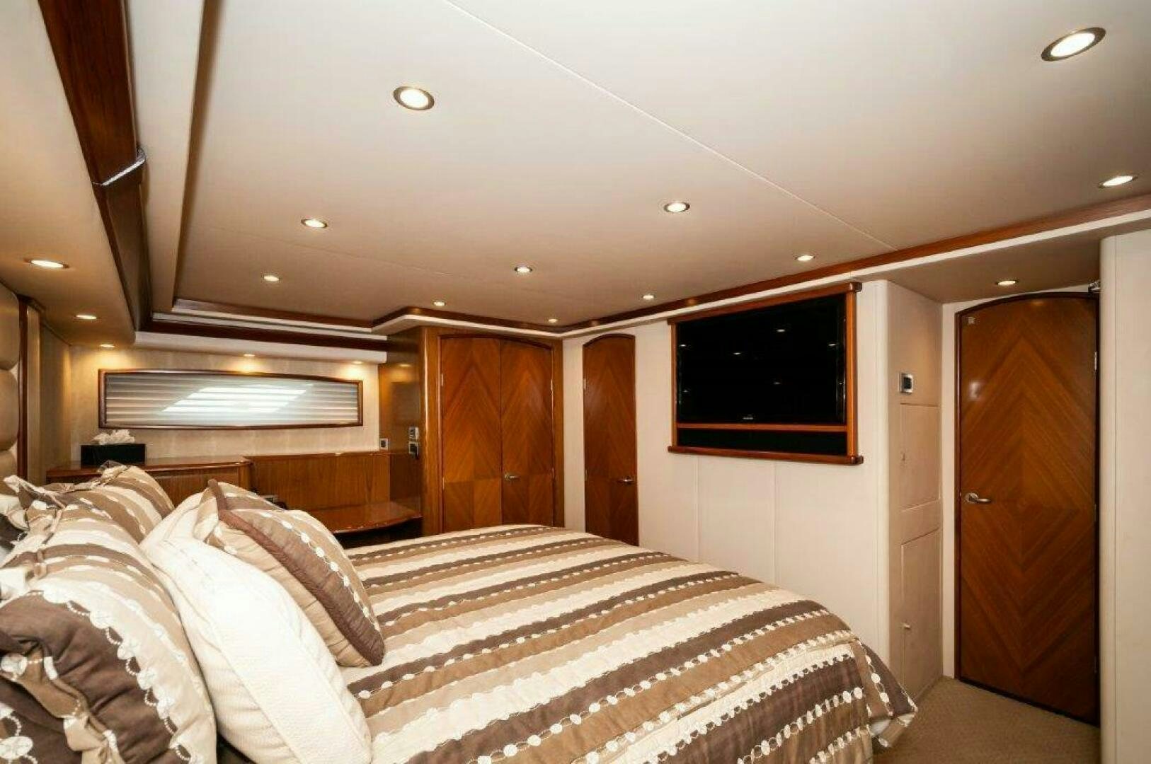 a room with a bed and a television aboard BAREFOOT DRIVE Yacht for Sale
