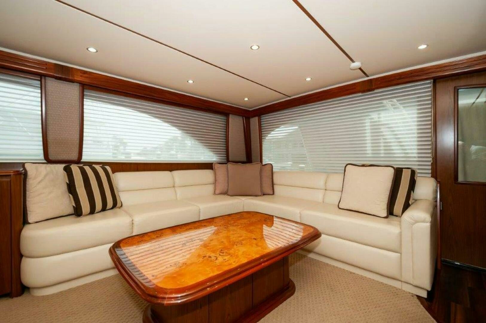 a living room with a couch and a table aboard BAREFOOT DRIVE Yacht for Sale