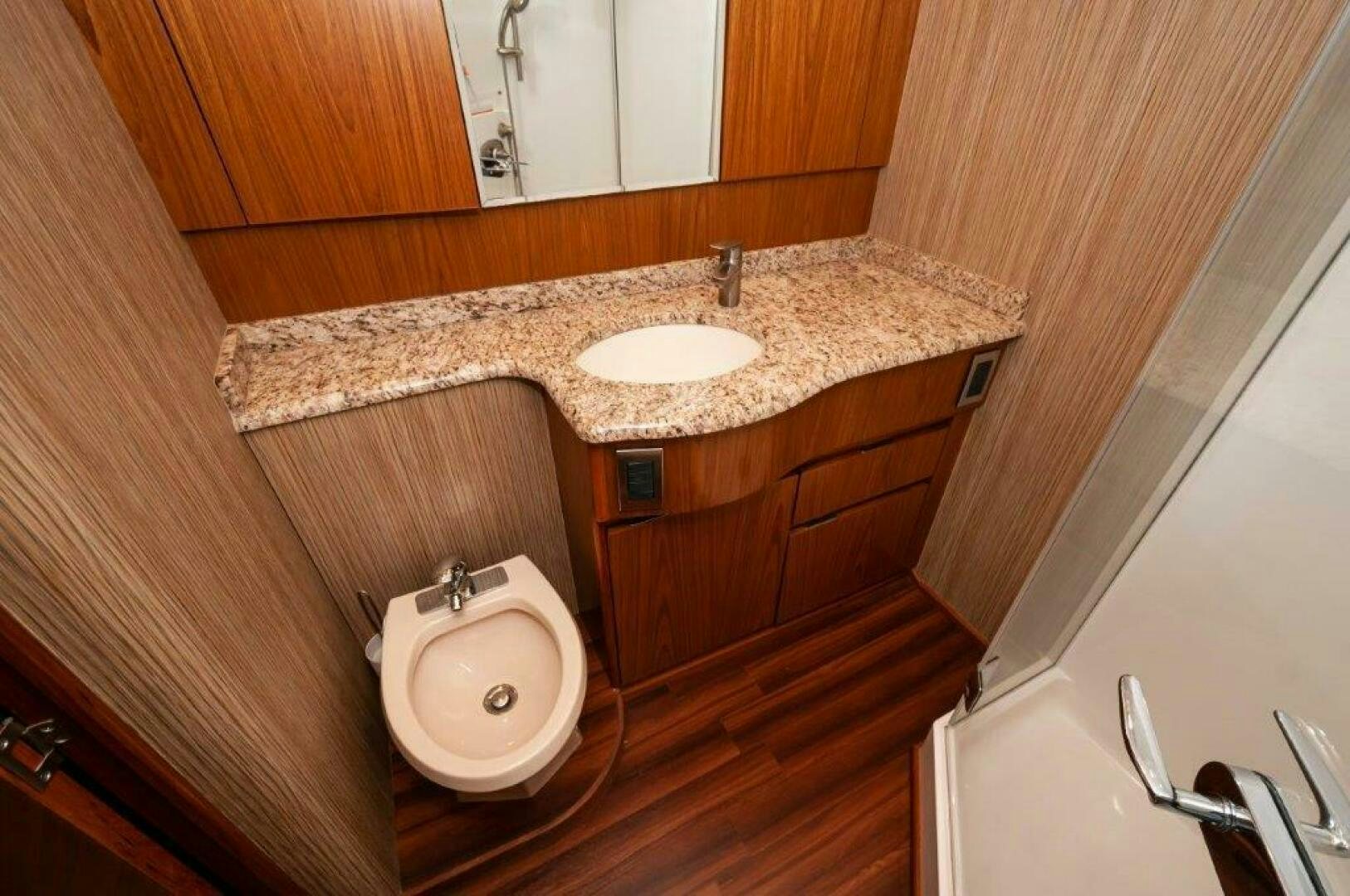 a bathroom with a sink and a mirror aboard BAREFOOT DRIVE Yacht for Sale